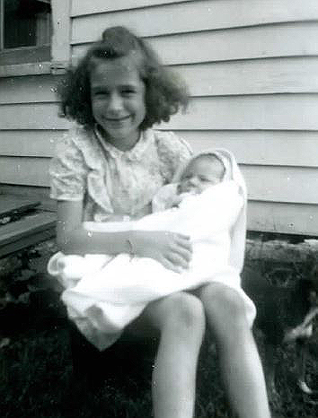 Earliest known (about 1 month) photo of Larry held by sister Janet